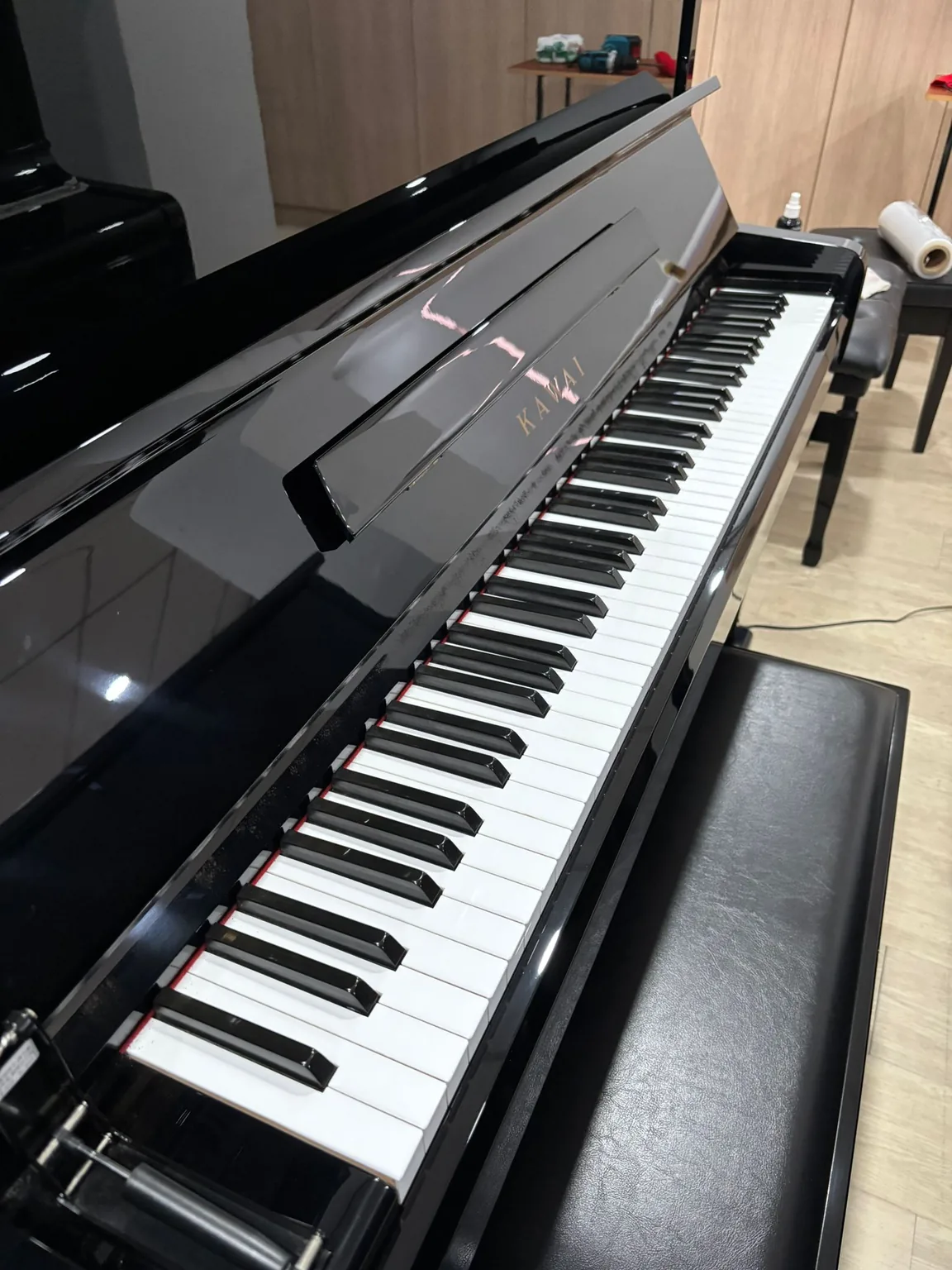 Interior view of Kawai BS-1N upright piano action and tuning pins