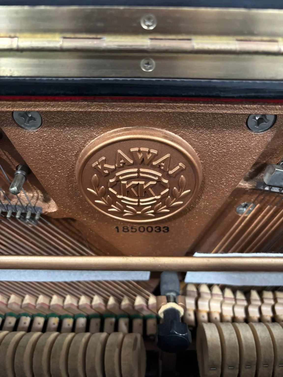 Kawai NS-10N serial number 1850033 stamped on the iron frame