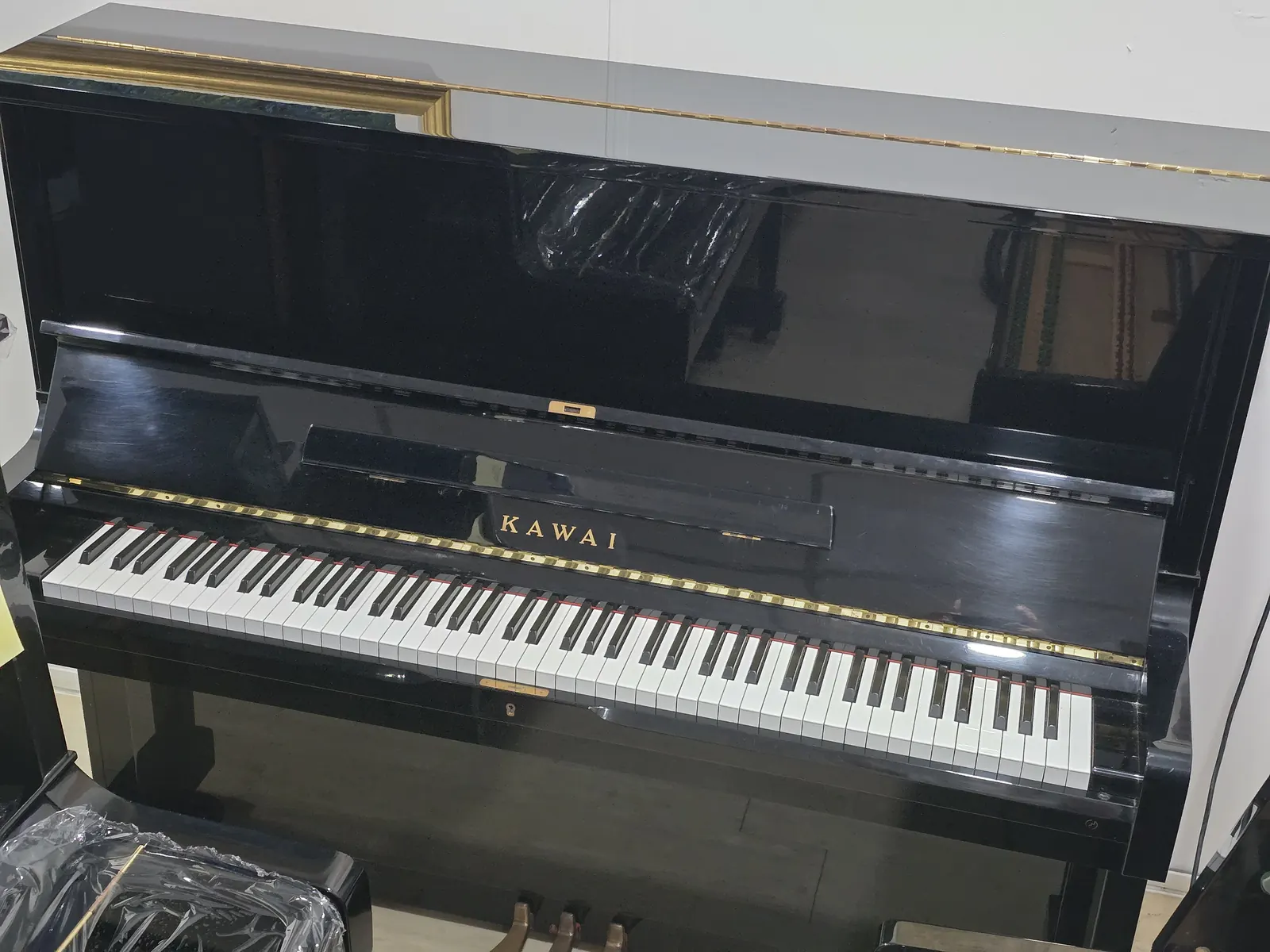 Kawai NS15 upright piano in polished ebony at Zadok Music Shoppe Singapore