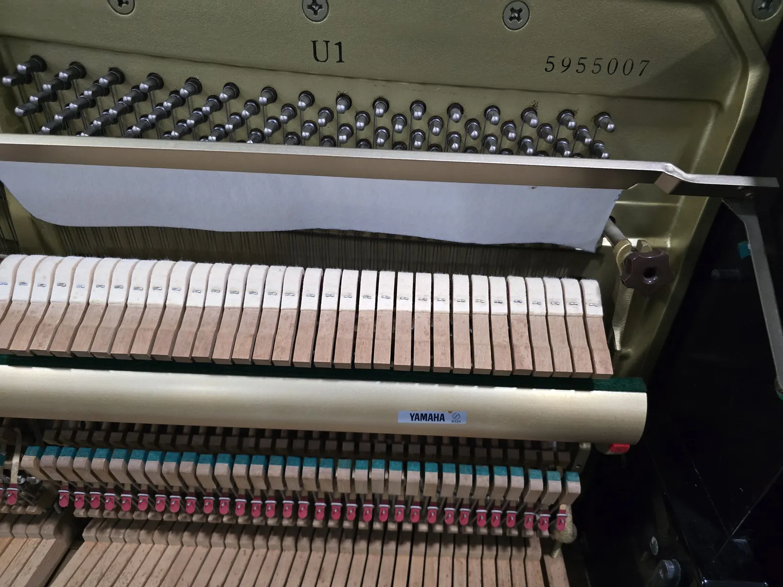 Interior action and frame of Yamaha U1 upright piano
