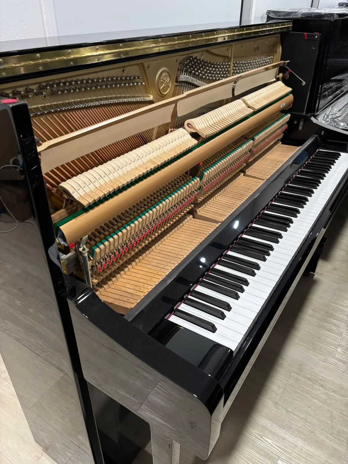 Interior action and frame of Yamaha U1J upright piano