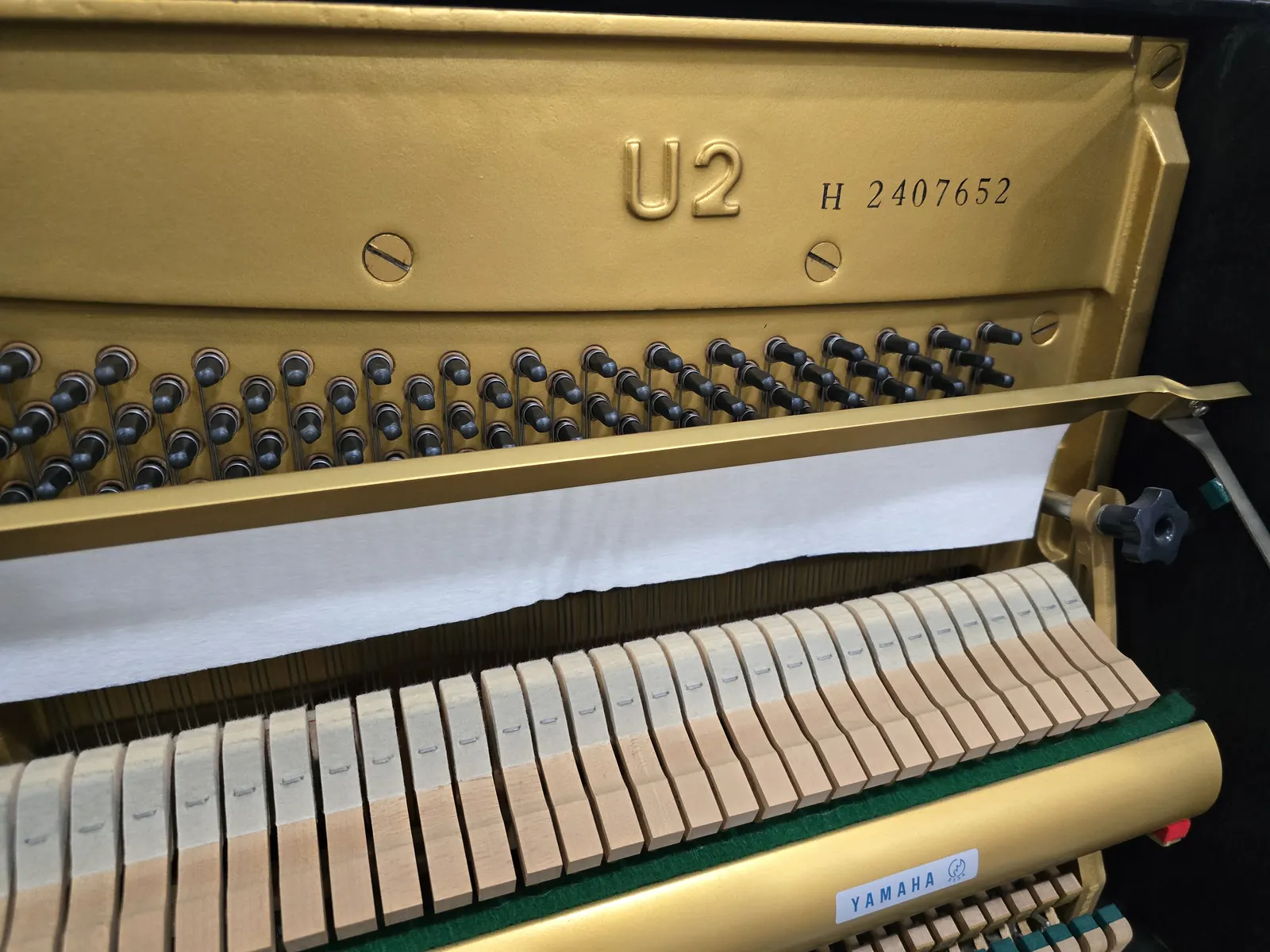 Interior action and frame of Yamaha U2H upright piano