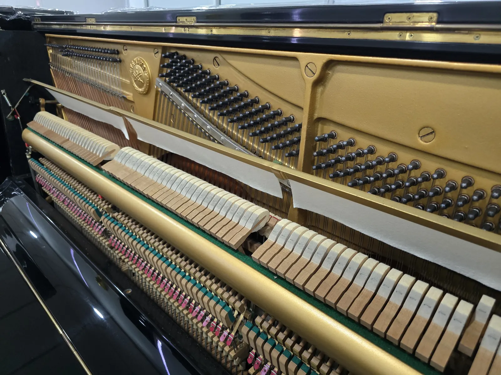 Interior action and frame of Yamaha U2H upright piano