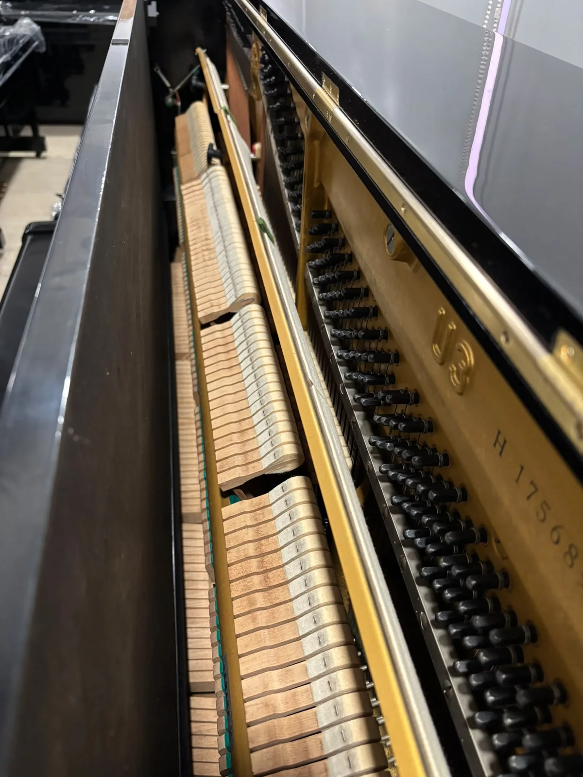 Interior action and frame of Yamaha U3H upright piano