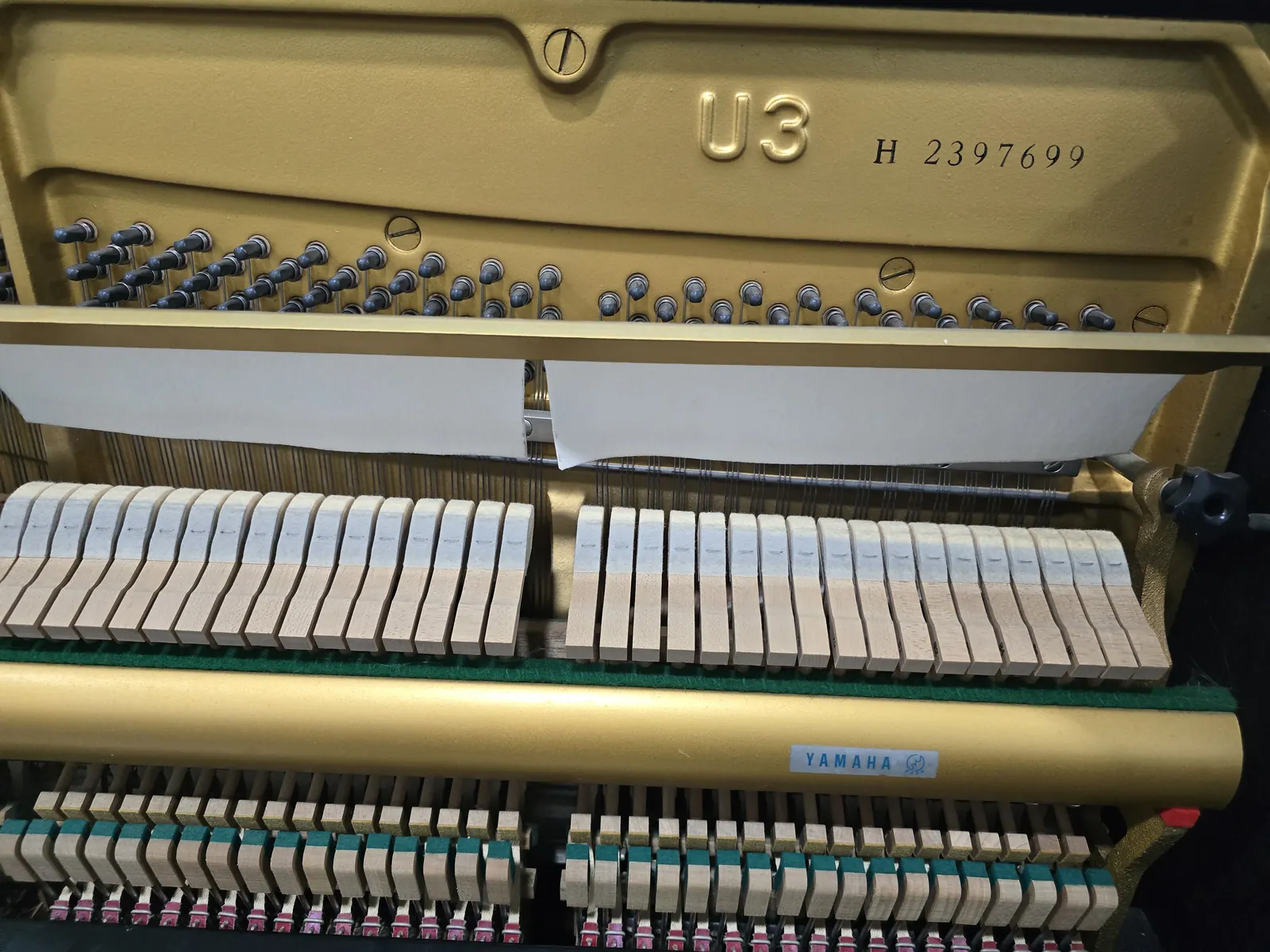 Interior action and frame of Yamaha U3H upright piano