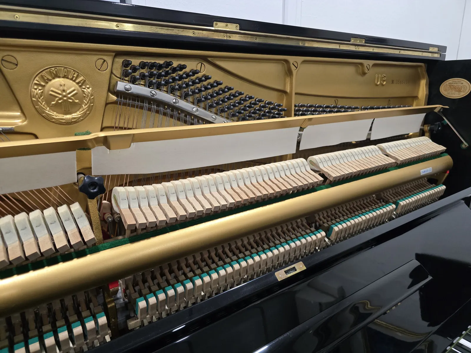 Interior action and frame of Yamaha U3M upright piano