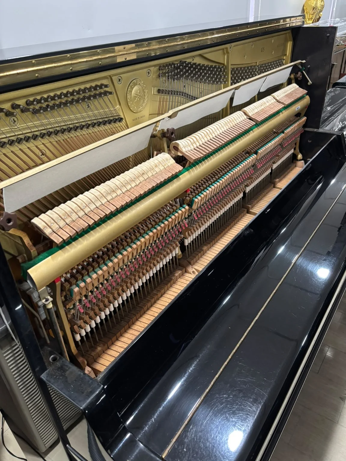 Interior action and frame of Yamaha U5 upright piano