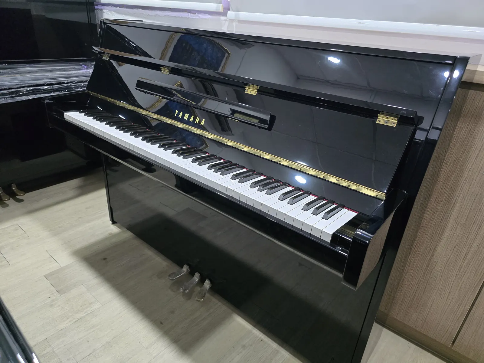 Yamaha JU109 upright piano in polished ebony at Zadok Music Shoppe Singapore