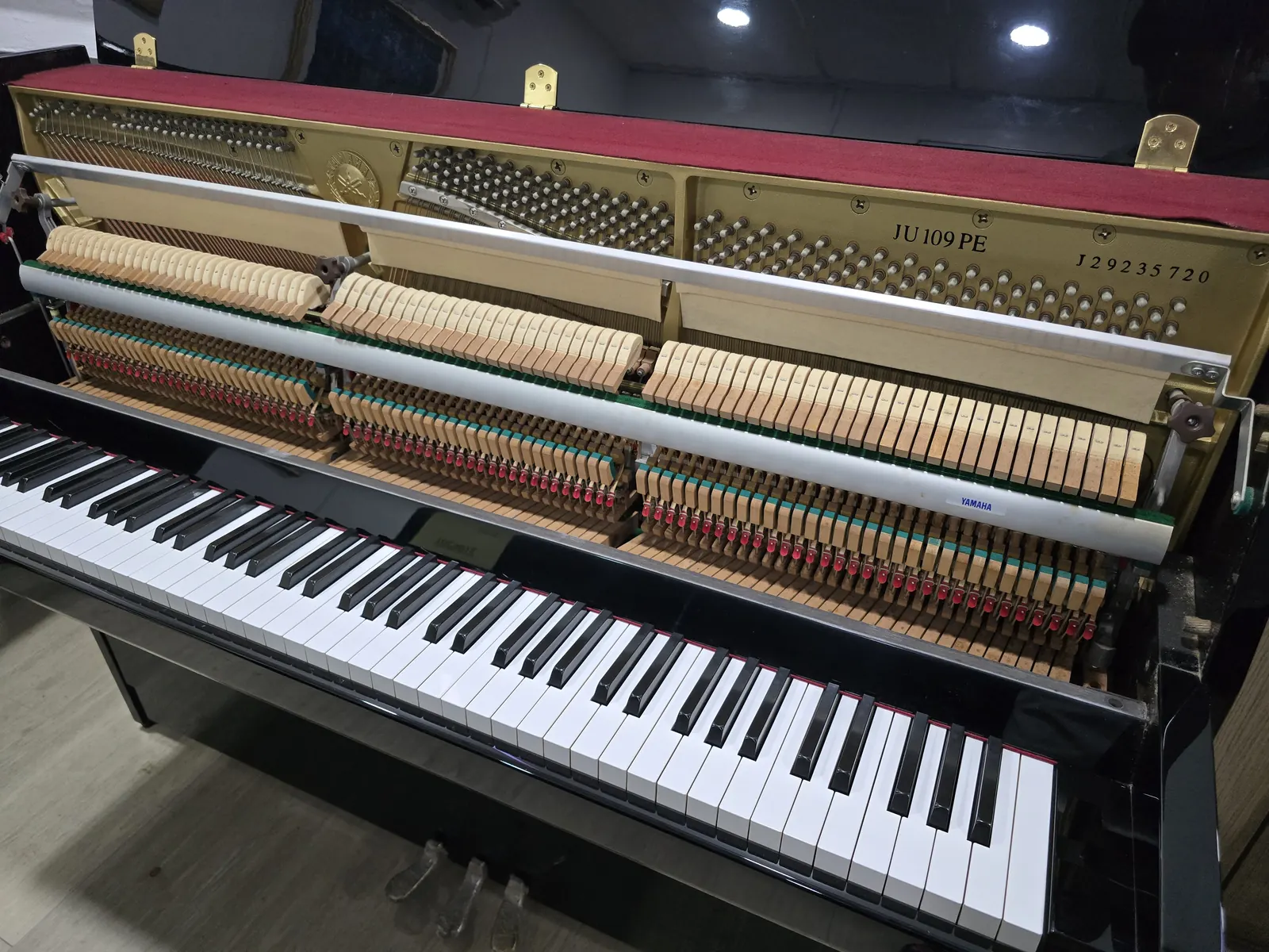 Interior action and frame of Yamaha JU109 upright piano