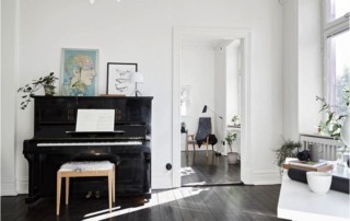 Piano in white room